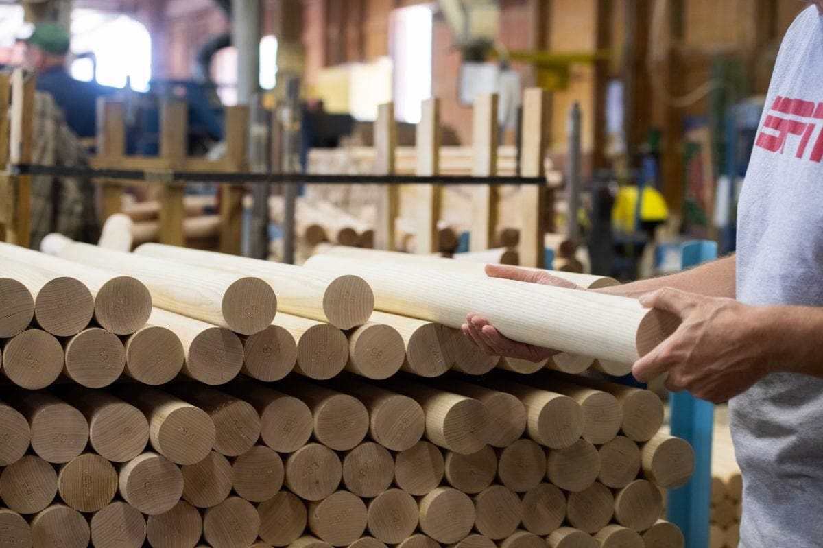 Brian Boltz, who runs the Larimer & Norton Mill, inspects an ash billet. Only 10,000 white ash billets — the piece of wood that becomes a bat — will be produced for major-league use at the mill this year, down from 50,000 in 2010.