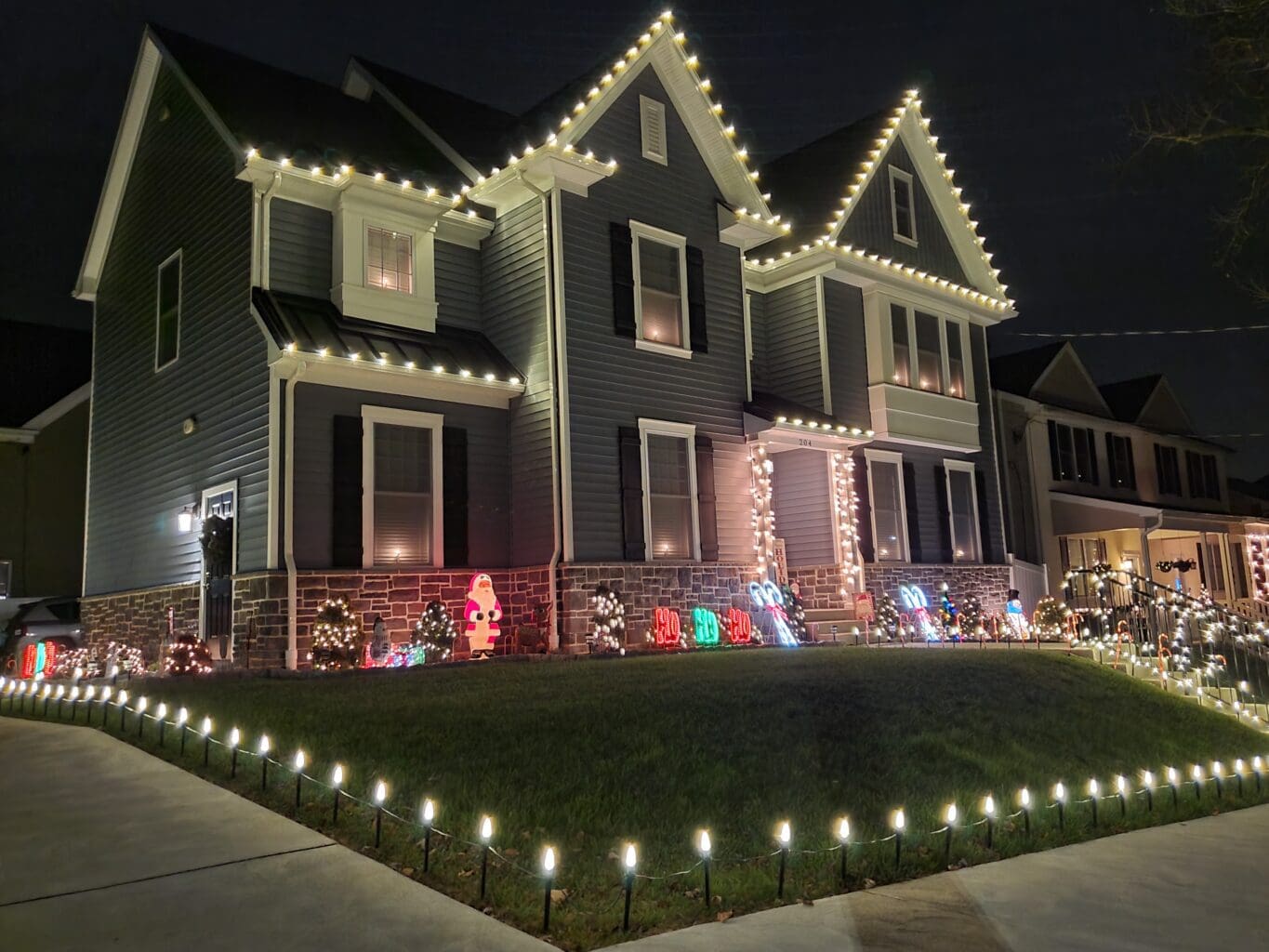 christmas lights on and around house