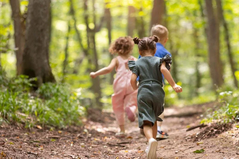 kids running along forest trail