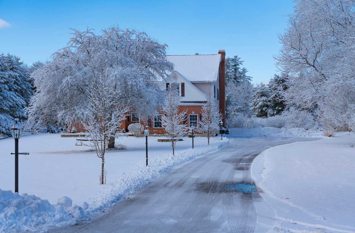 winter house and driveway after snow storm