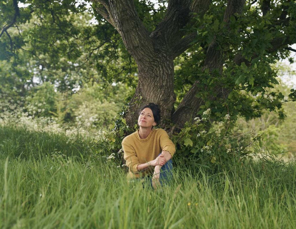 writer under a tree